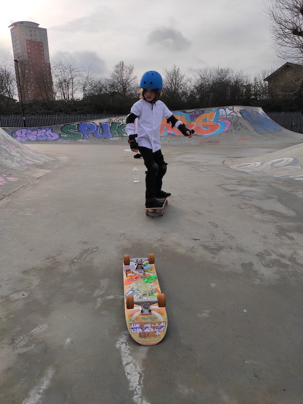 Isaac steering on his skateboard