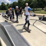 Rolling down bank on skateboard