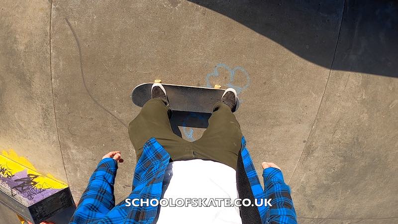 ride flat bank to fakie on skateboard